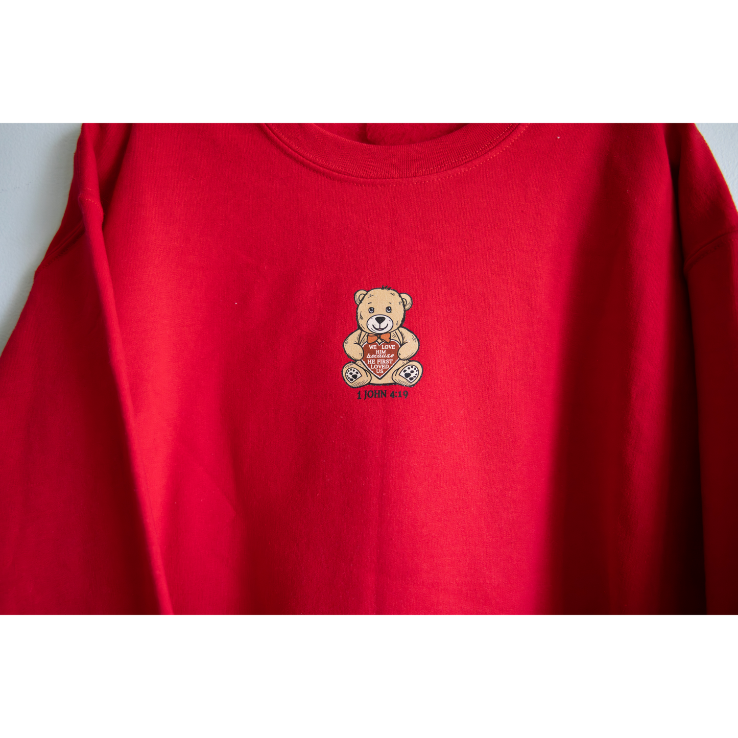 1 John 4:19 Crewneck